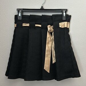 Cute black skirt with golden ribbon belt